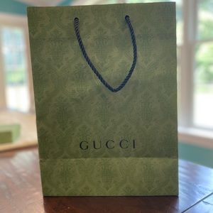 Medium green Gucci shopping bag. Black rope handles. 14" by 10".